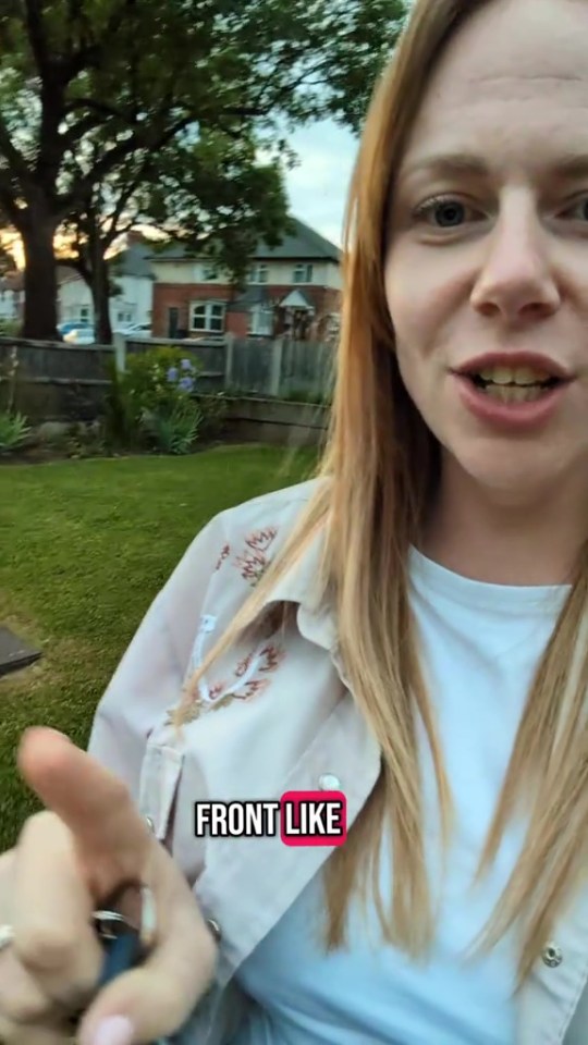 Woman in a garden talking to camera.
