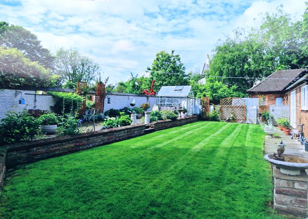 This image shows Mrs Hufton's garden before the wall collapsed 