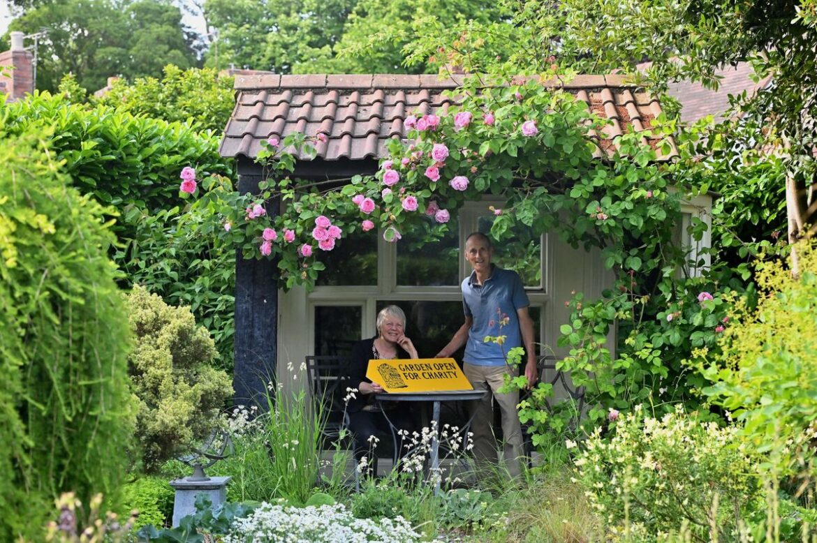 George and Fiona Chancellor in their garden at Windy Ridge in Little Wenlock