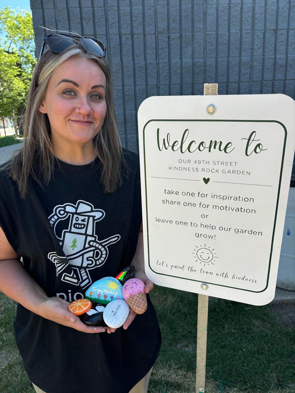 Stephanie Lindsay shows off some of her creations in the Kindness Rock Garden at the Lloyd Public Garden at 5107 and 49 St. in Lloydminster, Alta. 