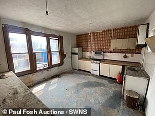 The kitchen is in dire need of plastering and new appliances