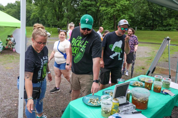 Zach Lewis of Harvey’s Lake takes a sample pickle to...