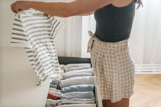 Woman folding clothes