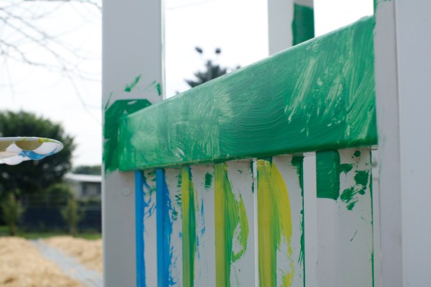 Children, staff and parents work together to paint the Easton Urban Farm's gazebo Monday, June 30, 2025. The nonprofit, which supplies fresh produce to low-income families, invited children ages 5-10 for a tour of the garden, an opportunity to pick raspberries and an art session to paint the gazebo. (Oliver Lois Economidis/The Morning Call)