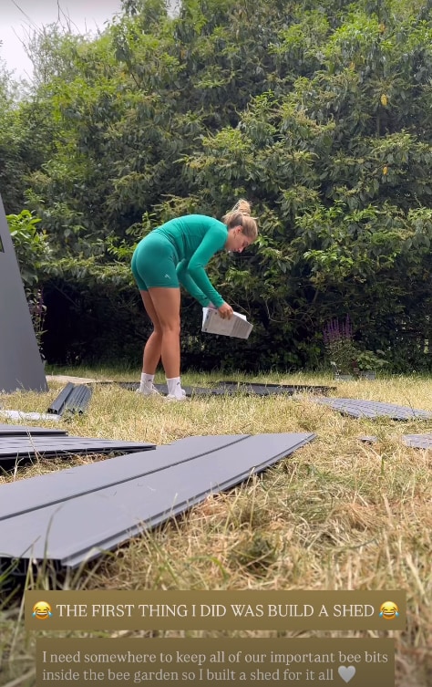 Stacey Solomon in her garden putting together shed
