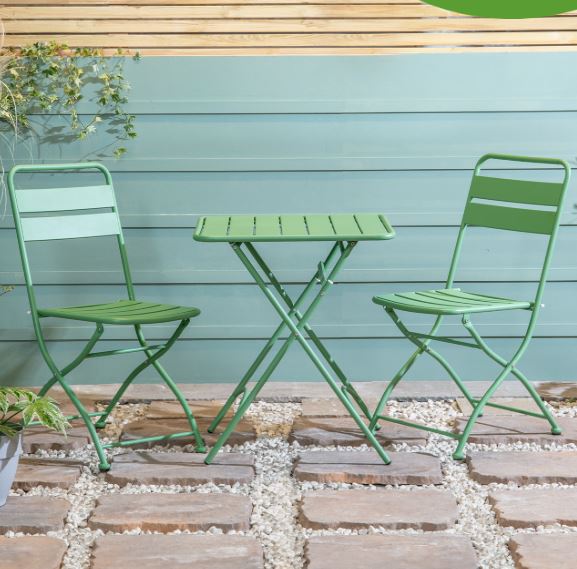 Green bistro set with table and two chairs.