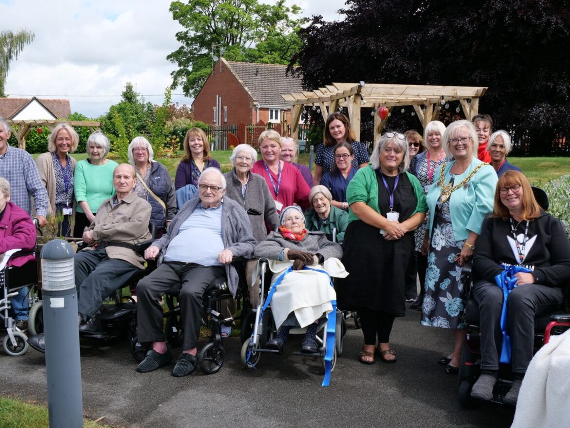 Vibrant sensory garden officially opens at Chirk nursing home (L-R) Jane Humphreys - Manager at Chirk Court, Wrexham Mayor - Cllr Tina Mannering, Kerry Evans - Disability Liaison Officer, Wrexham AFC.