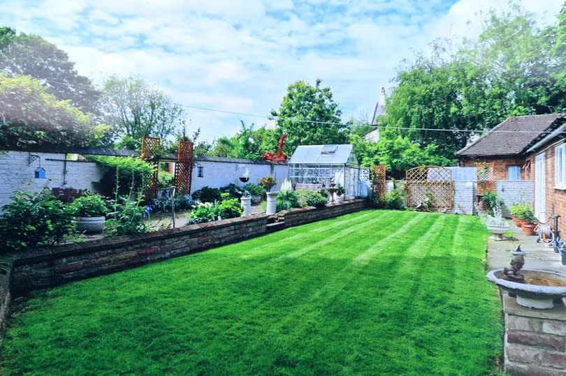 This image shows Mrs Hufton's garden before the wall collapsed