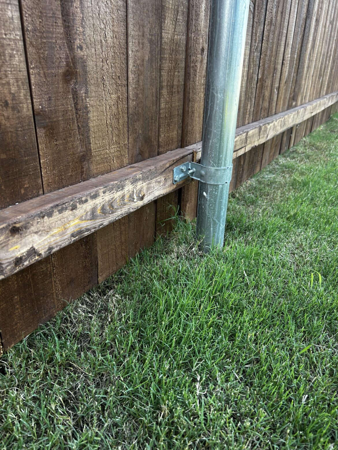 How do you guys get weeds behind fence posts?