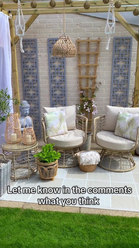 A renovated patio with wicker furniture, lanterns, and plants.