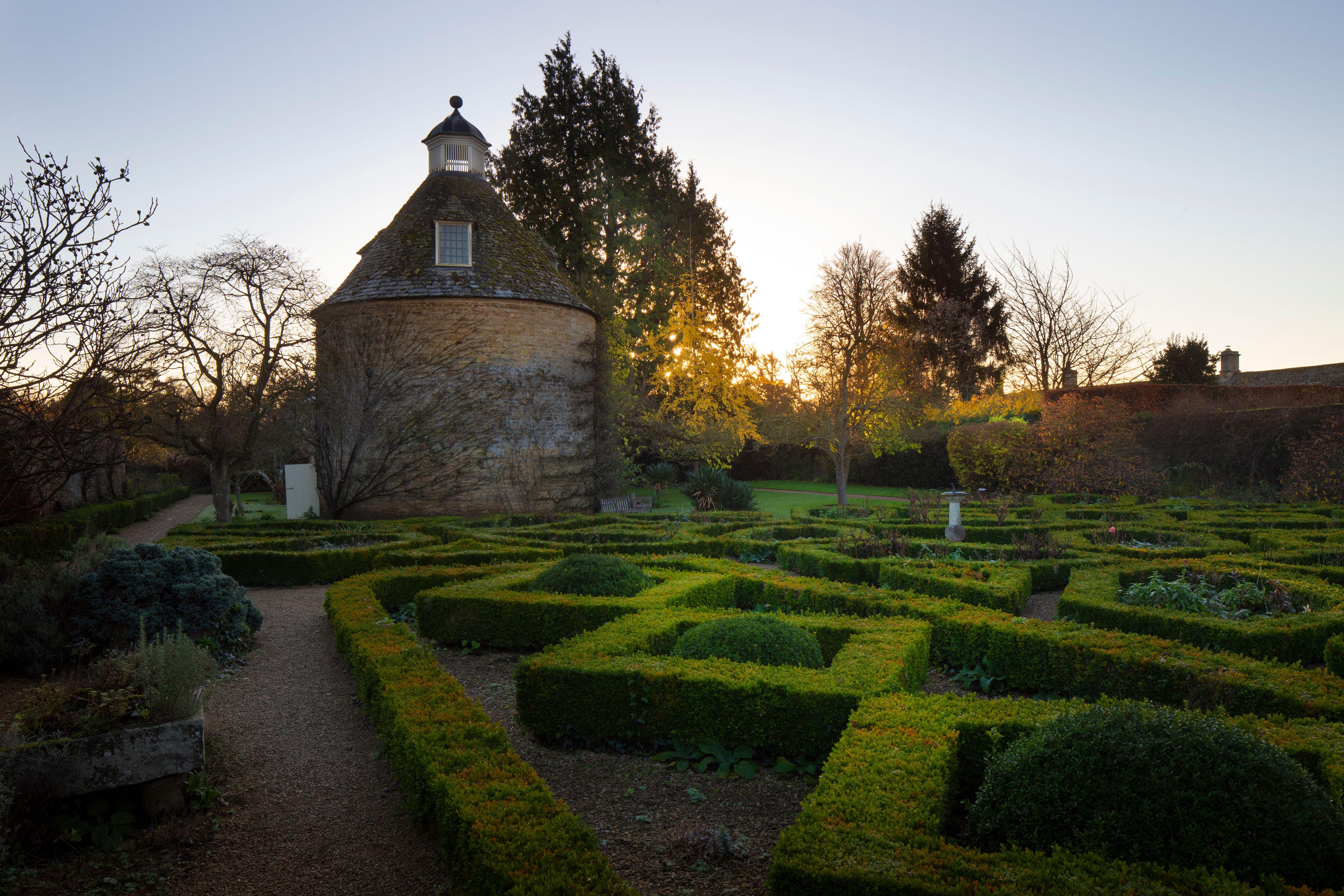 Dovecote and parterre box hedging at Rousham House.