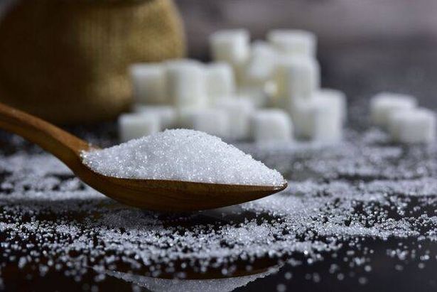 Closeup sugar piling up the shape of the hill from