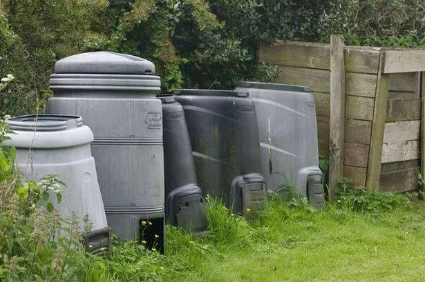 Row of plastic compost containers
