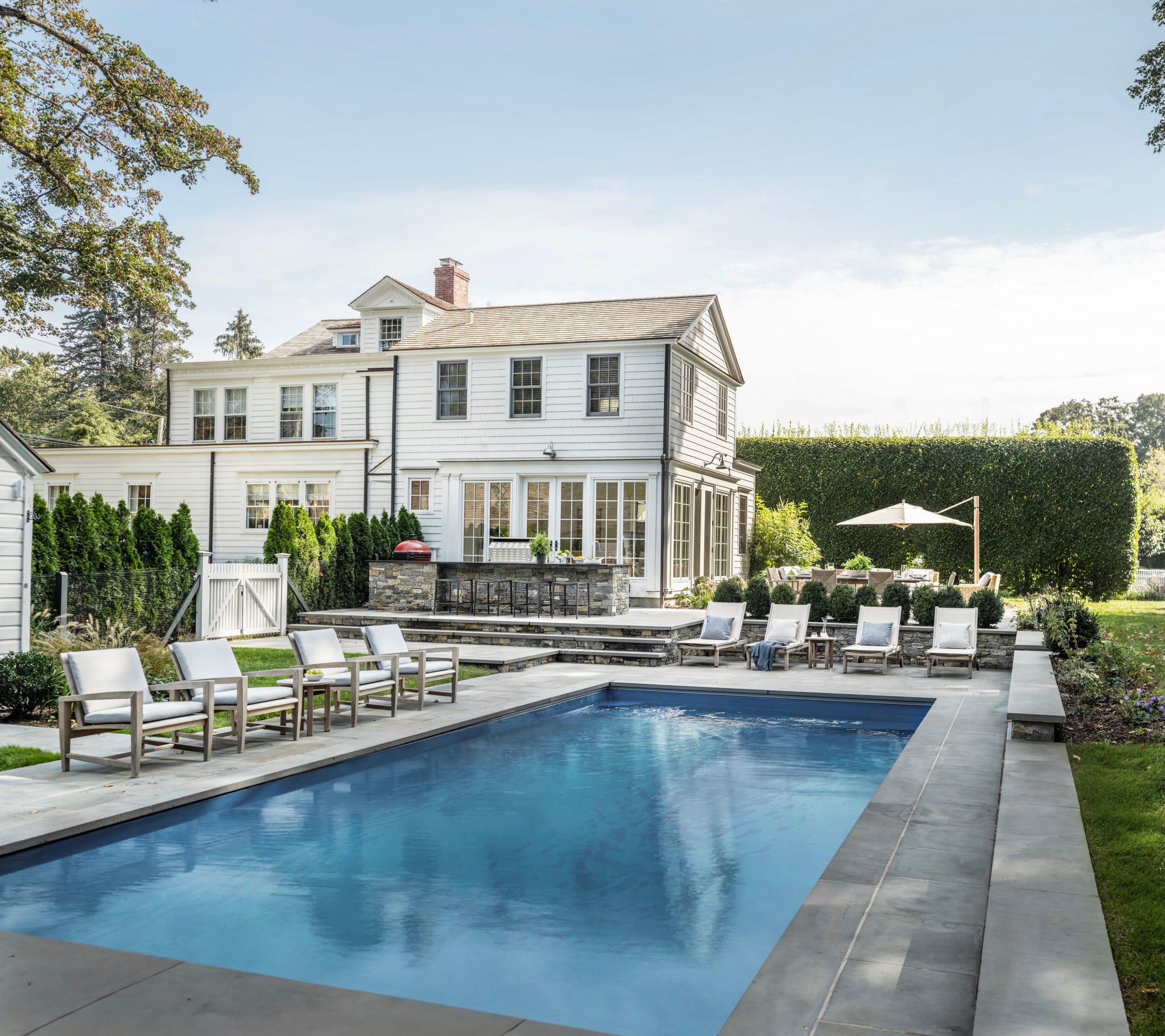 pool with chaises and umbrellas
