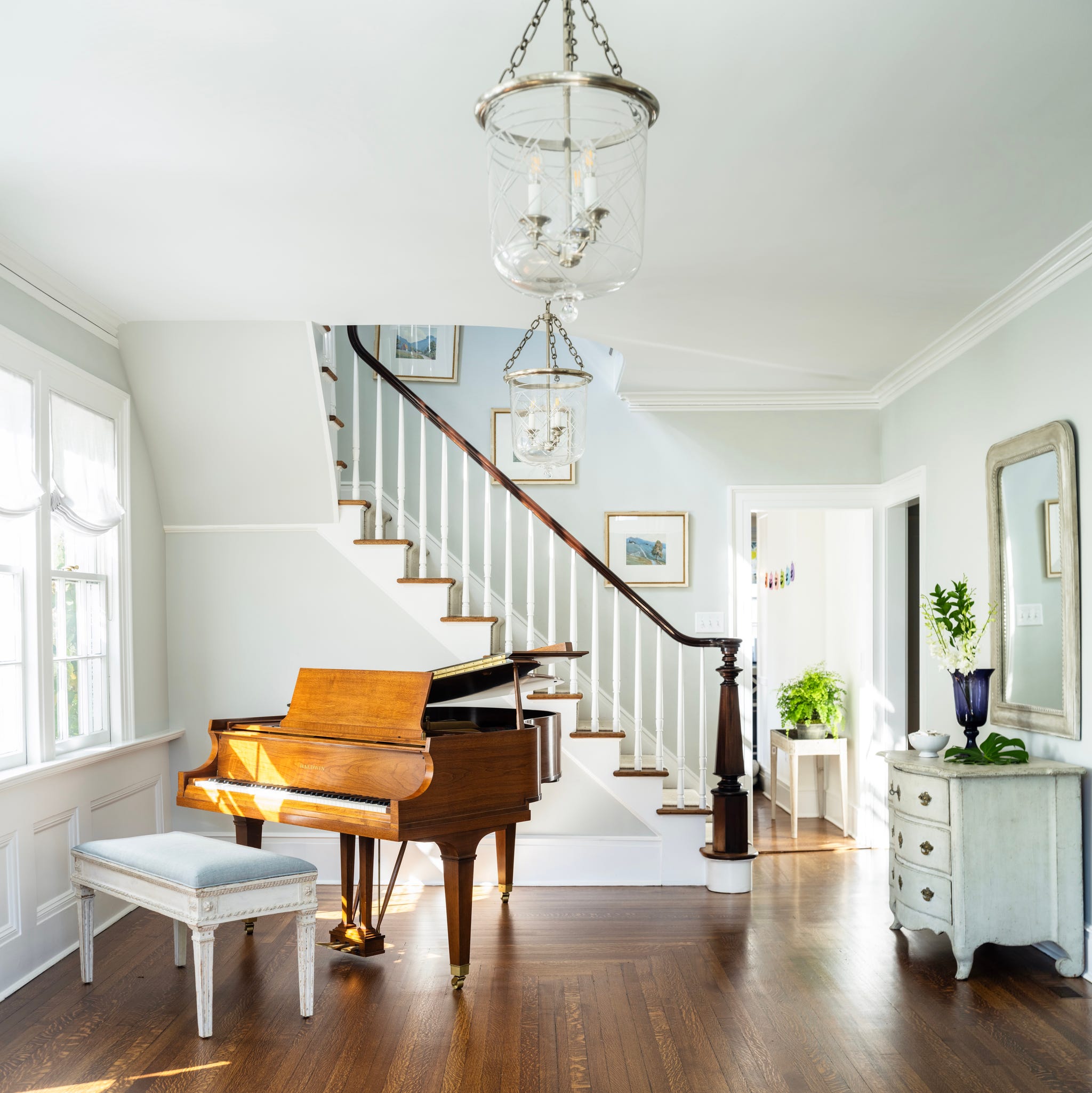 piano in front of staircase