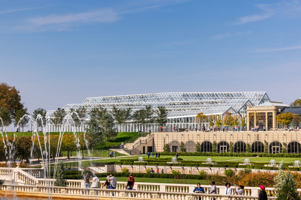 Botanical garden featuring a glass greenhouse and landscaped gardens