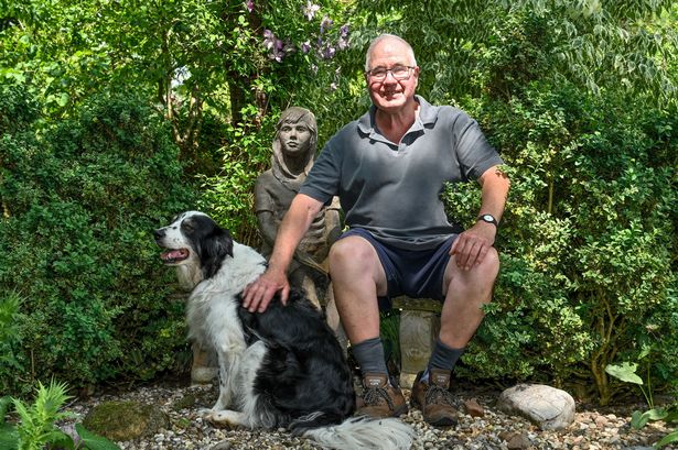 John sat next to his dog