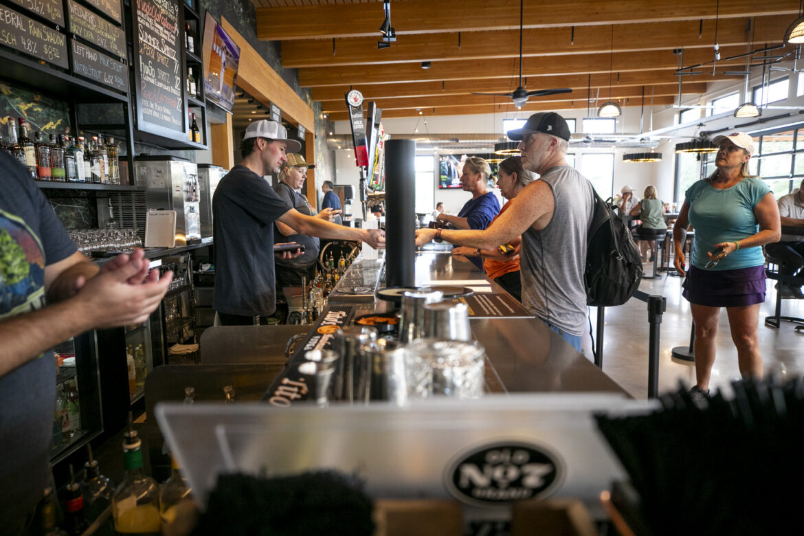Hundreds turn out for Arvada Beer Garden opening A QuikTrip convenience store before a slightly cloudy sky.