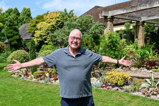 John standing proudly in his garden