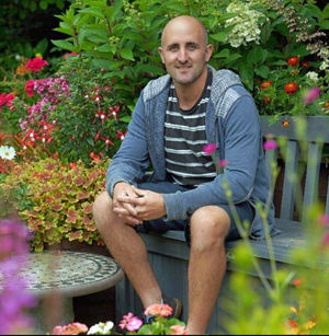 Tom Pountney sat in his garden at Offcot.