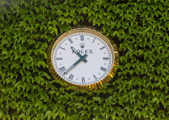 The ivy needs to be trimmed back to keep the famous clock on display The ivy needs to be trimmed back to keep the famous clock on display