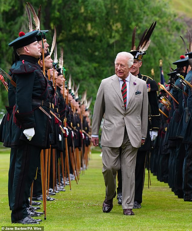 The King was greeted with pipes and drums - plus bows and arrows - as he arrived for his traditional official week in Scotland.  Here, he can be seen inspecting a Guard of Honour of soldiers from the Royal Company of Archers, who serve as the King's ceremonial bodyguard in Scotland - a role first created in 1822 for King George VI