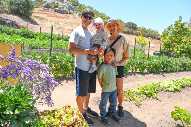 The Lee family enjoying the Sunshine Garden. From left, Dennis,...