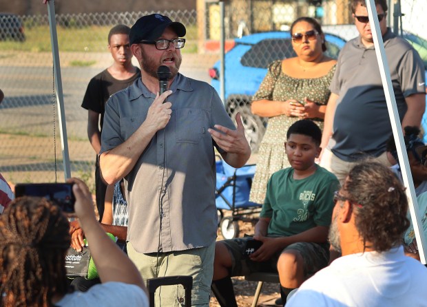 Corey Hagelberg, co-director of the Brother's Keeper Garden, addresses the crowd during a showcase of a Farm Tour and Low Tunnel Build by the Gary Food Council on Wednesday, July 31, 2024. (John Smierciak/for the Post-Tribune)