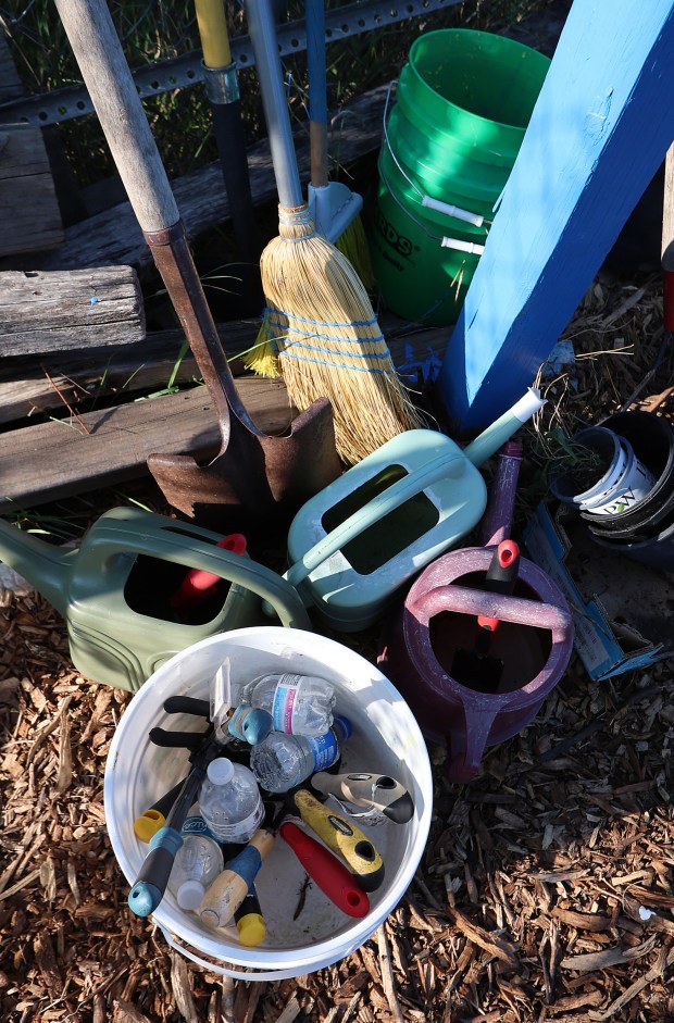 Gardening supplies wait to be grabbed up during a showcase of a Farm Tour and Low Tunnel Build by the Gary Food Council at the Brother's Keeper Community Garden in Gary on Wednesday, July 31, 2024. (John Smierciak/for the Post-Tribune)