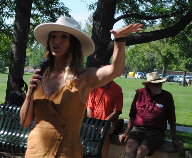 Sculptor Amanda Markel talks about her piece, Ridge Runners, which was installed in the south section of Benson Sculpture Gardens on Friday and was dedicated on Saturday. Markel lives in Montana. (Pamela Johnson / Loveland Reporter-Herald)