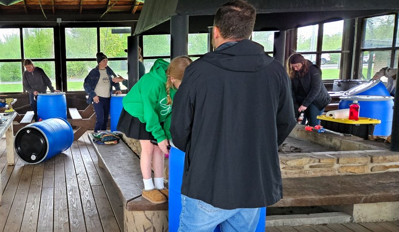 Rain barrel workshop participants start the process of building their barrels during the class at Bath Nature Preserve on May 6, 2025. The class is one of several sponsored by the Summit Water and Soil Conservation District.