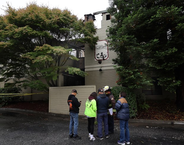 Central Fire Captain Jack Kokot confers on Monday with the...