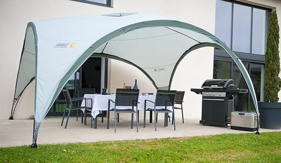 Gazebo with patio furniture and grill.
