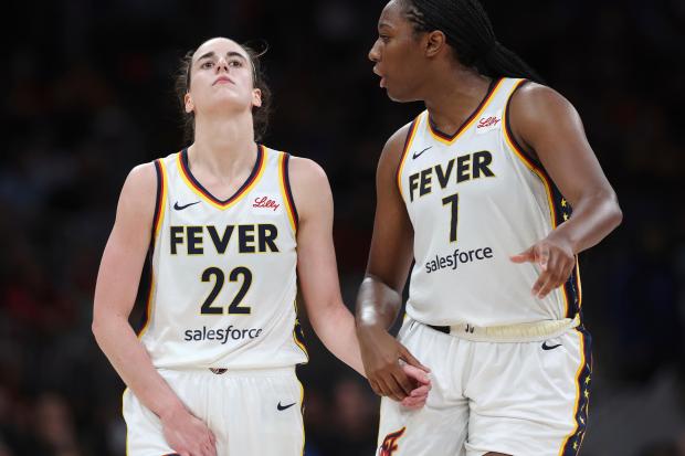 Indiana Fever’s Caitlin Clark (22) reacts with a possible injury...