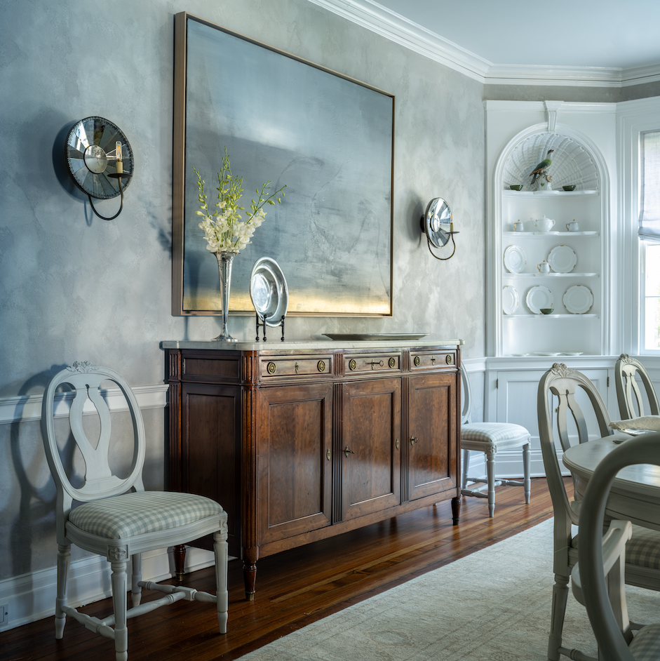 dining room with sideboard and artwork