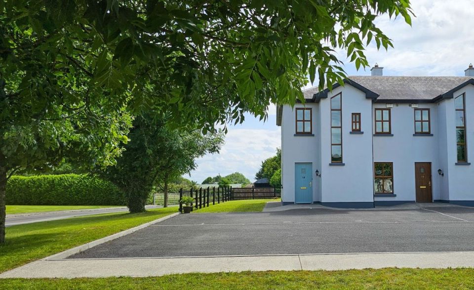 House with light blue door and dark brown door.
