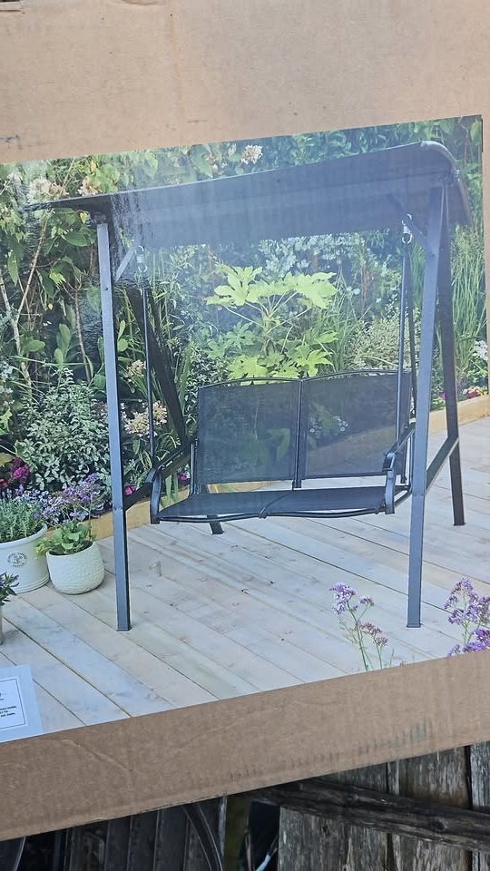 Two-person garden swing with canopy.