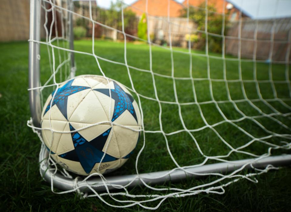 Soccer ball in net.