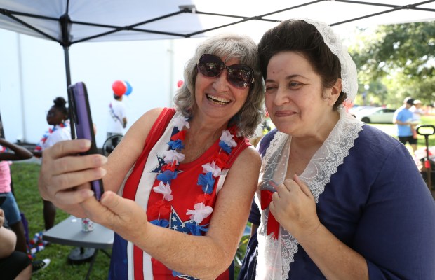 Left to Right, Wanda Kenney snd Marcea Oetting (as Abigail Adams) pose for a photo during the Winter Garden Masonic Lodge All American Kids Parade & Breakfast in downtown Winter Garden, on Friday, July 4, 2025. (Ricardo Ramirez Buxeda/Orlando Sentinel)