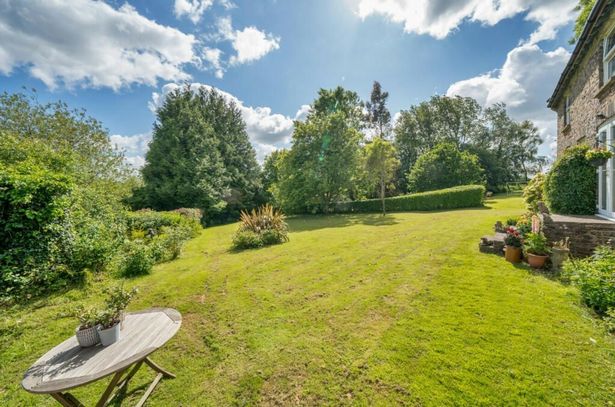 The property is surrounded by its own gardens