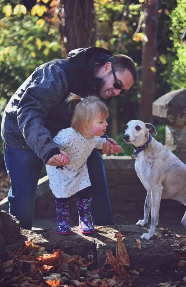 little girl, man and dog