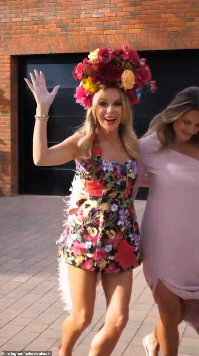 She flashed a wave to the camera