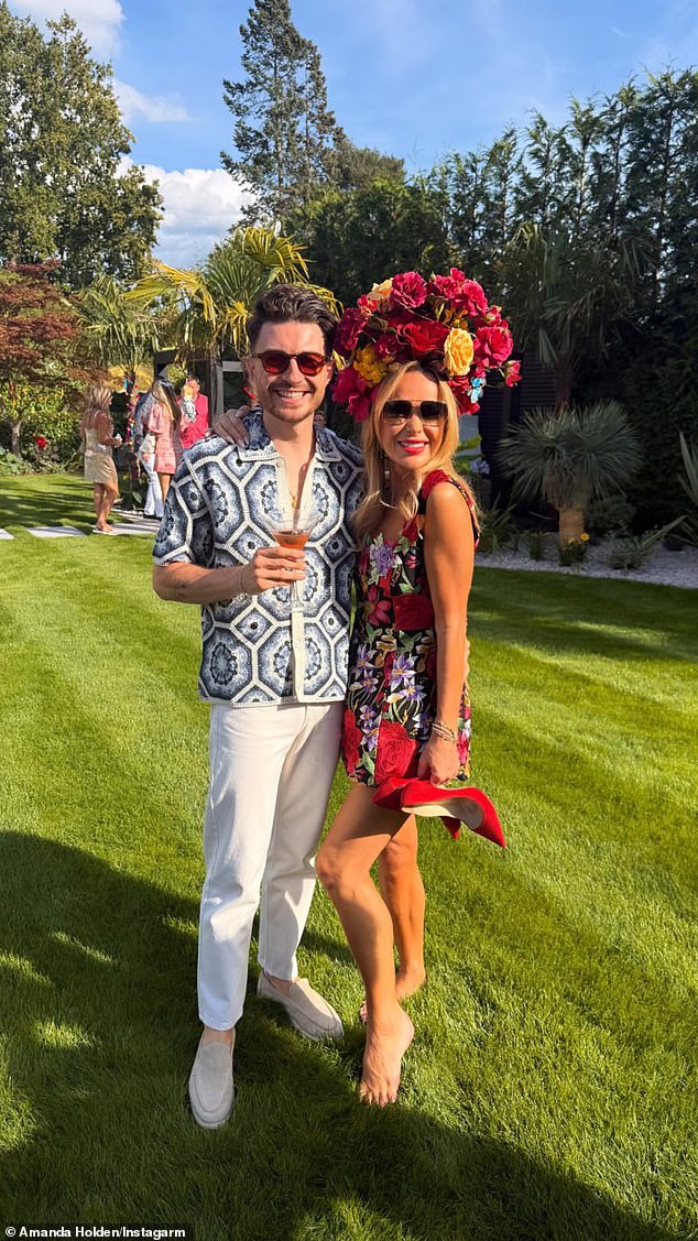 Amanda posed with one of her pals in the garden