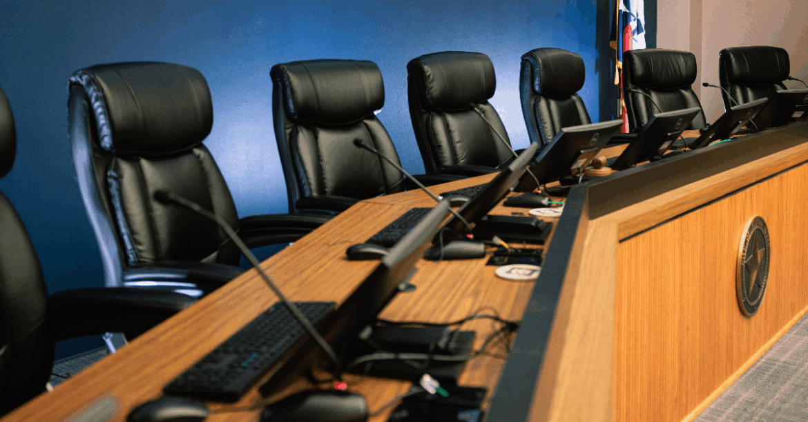 News Flash • Bedford TX • CivicEngage close up view of the dais with chairs within the Bedford City Council Chambers