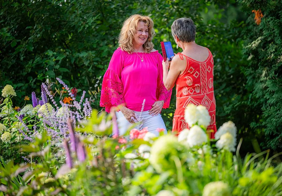 Maggie Maier had a friend take her photograph among the spectacular lush gardens.