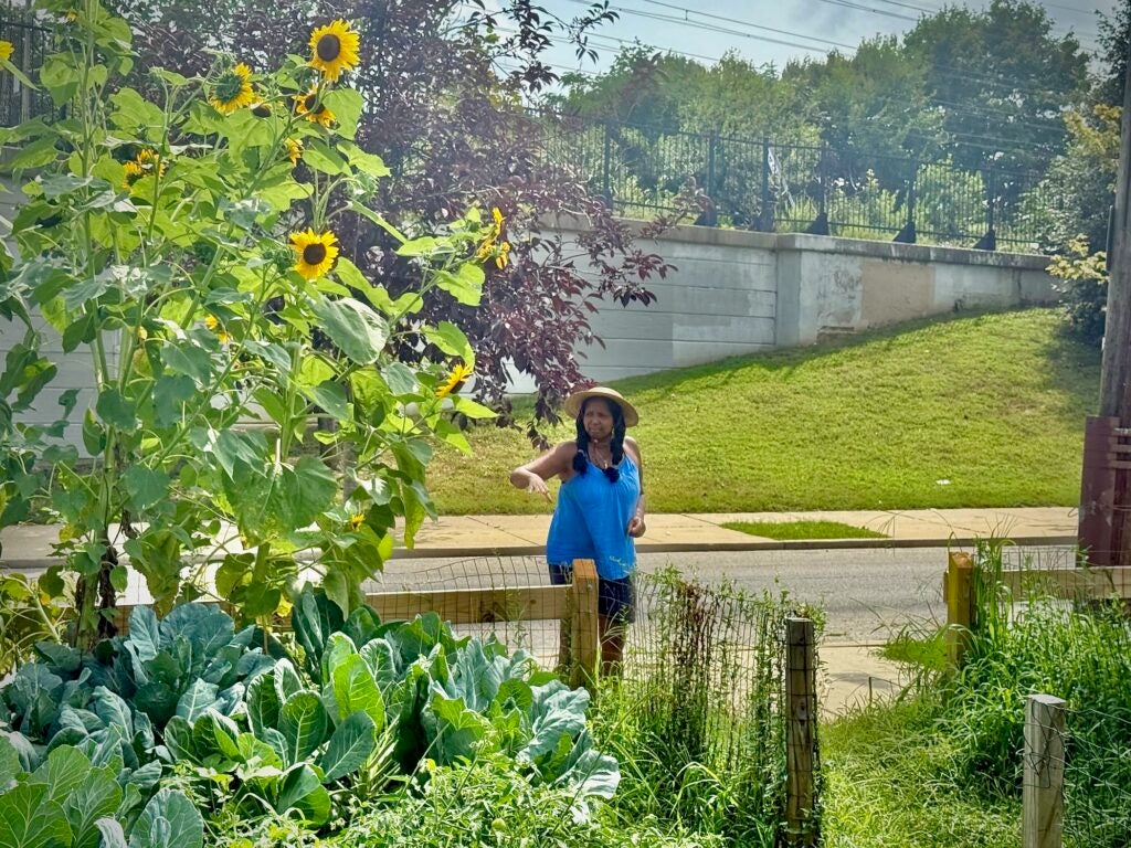 Estelle Vaughn posing for a photo in the garden