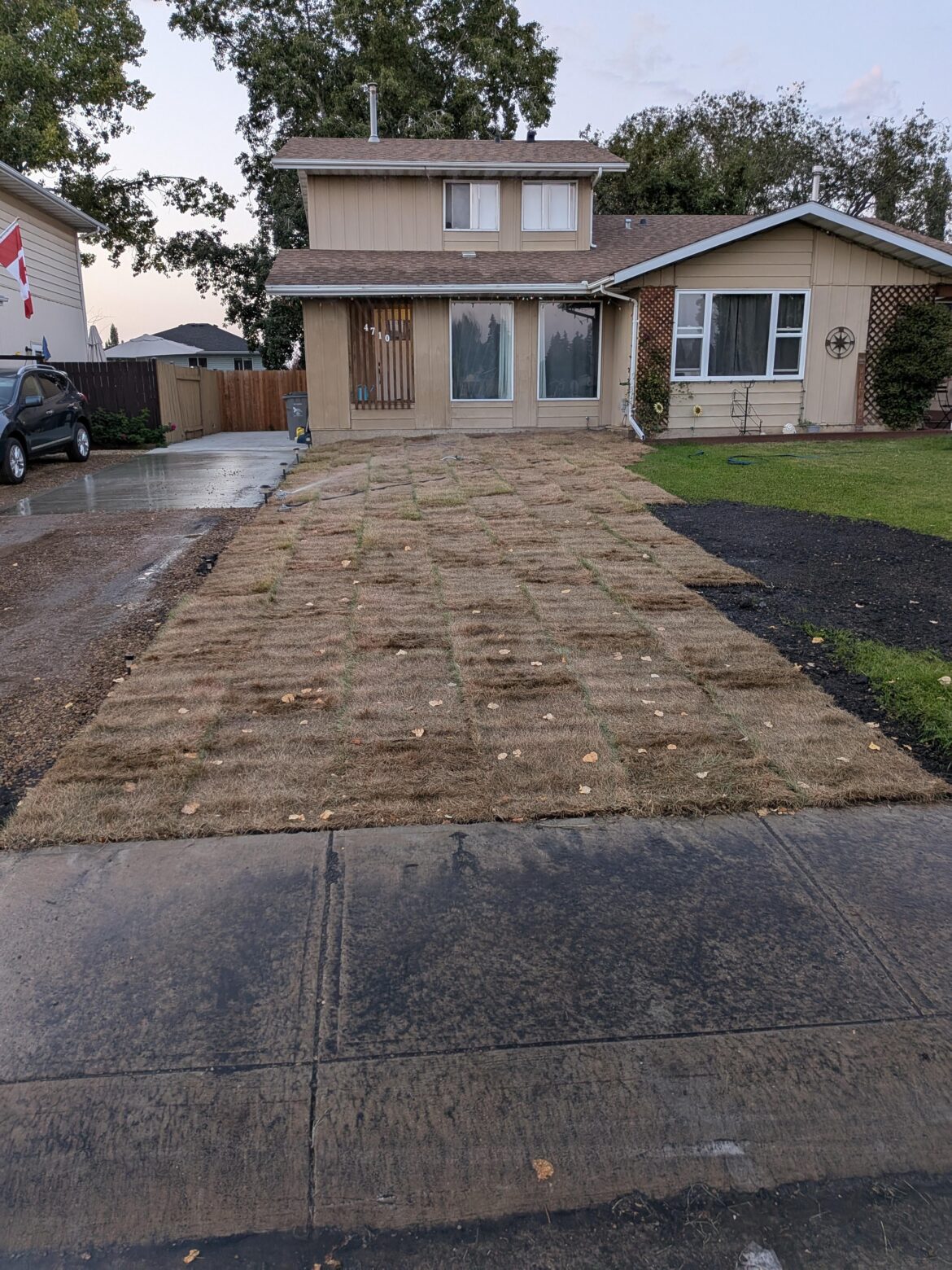 Dude's running two sprinklers trying to baptize his dead sod into a spiritual rebirth.