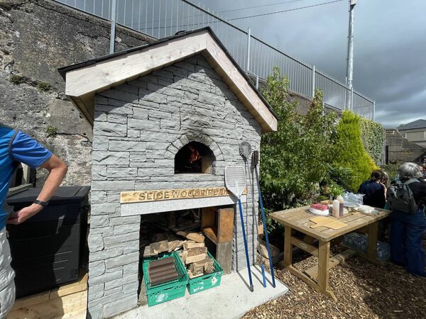 The woodfire pizza oven was built by stonemason Christy Sheehan. Slice Wood Fire Pizza Chef John Keane cooked pizzas for everyone. 