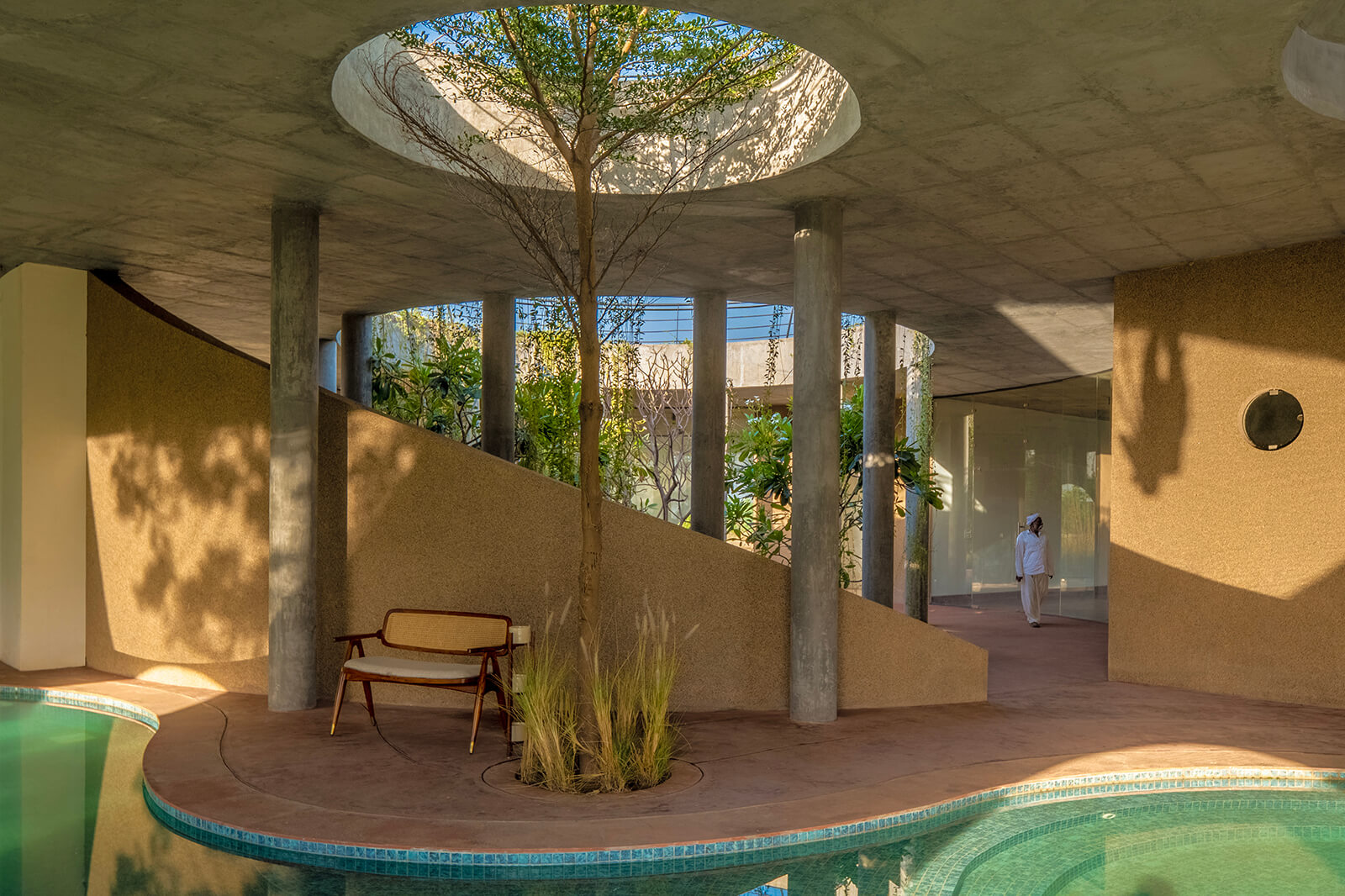 Roof cut-outs cast dynamic shadows on the pool’s surface | Habitat 0 | RA Design Studio | STIRworld