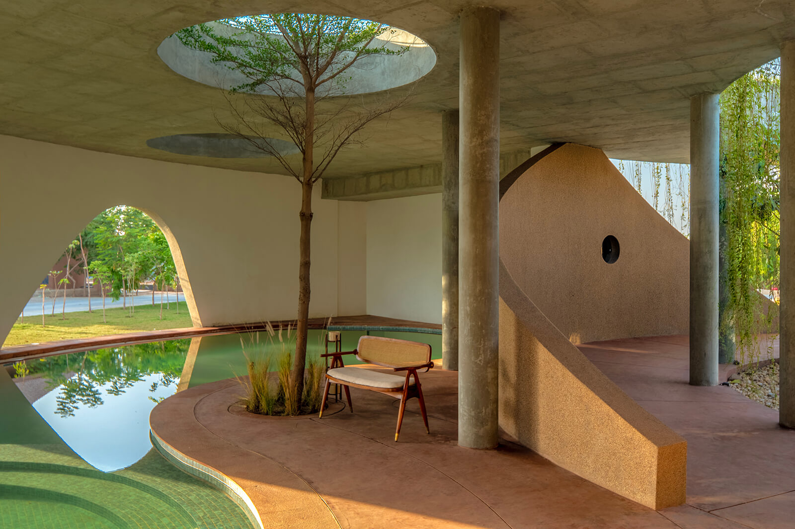 The pool faces the sculptural arches opening up to the landscape | Habitat 0 | RA Design Studio | STIRworld